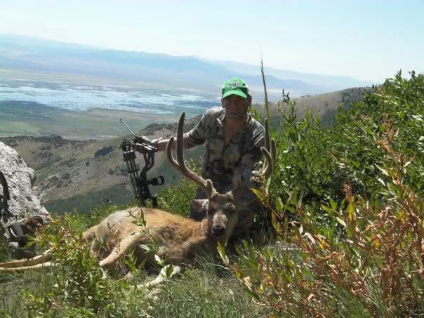 Darren with a mule deer taken with a bow